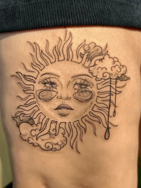 Fine-line tattoo of a sun with a weary face, clouds and a dripping rain cloud on the ribs