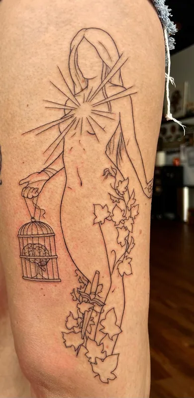 Linework tattoo of a standing figure with a sunburst at the chest, ivy at her feet and a birdcage in hand, on a thigh