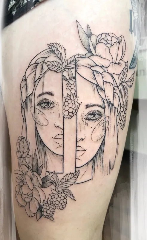 Fine-line black-and-grey tattoo of two women's faces split and offset, with braids, peonies and raspberries, on a thigh