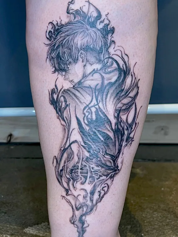 Black-and-grey anime tattoo of a dark-haired character seen from behind, wreathed in smoke and dark energy, on a calf