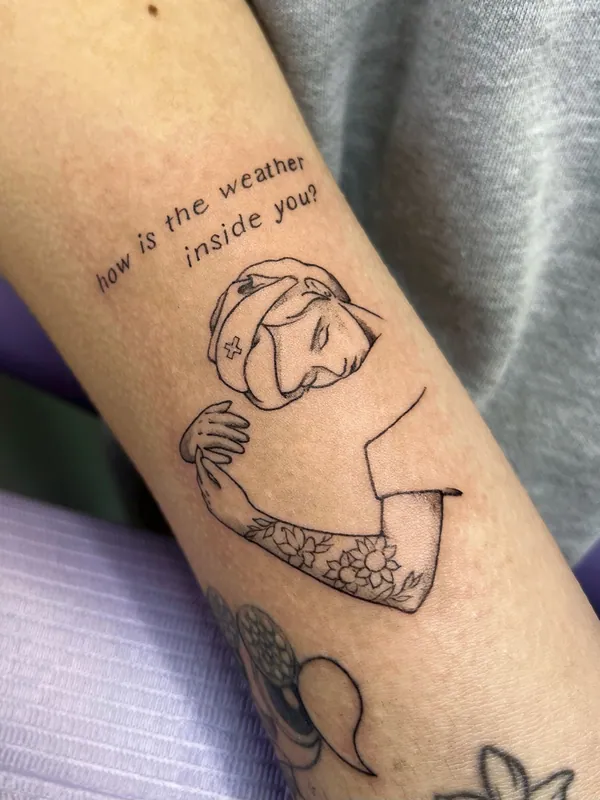 Linework tattoo of a figure hugging themself beneath the words 'how is the weather inside you?' on a forearm
